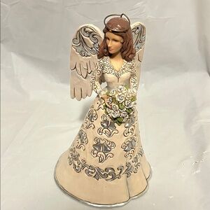 Jim Shore 25th anniversary figurine.